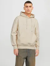 Hoodie tipo canguro color beige claro, de manga larga con capucha y fit regular. Cuenta con un bolsillo y estampado de goma con la palabra "Originals".