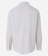 Camisa blanca de algodón, manga larga con botonadura frontal y cuello camisero.