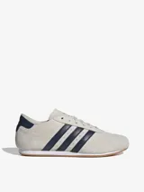 Championes Adidas Taekwondo Lace color crema con detalles en azul marino.