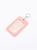 Llavero porta tarjeta rosado con frase motivacional estampada en letras de colores.