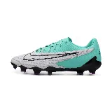 Championes de fútbol Nike Phantom GX AC Academy, color blanco con detalles en turquesa y negro, con tecnología NikeSkin y suela con tapones morados.