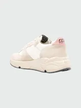 Championes Golden Goose Running Solè, color beige con detalles en rosa.