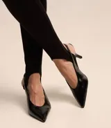 Pantalón legging negro de punto roma con cintura elástica y pies.