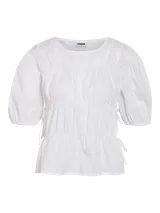 Top blanco de algodón con mangas abullonadas, cuello redondo y corte peplum.