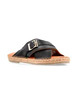 Sandalia de cuero negro con tiras cruzadas y hebilla dorada. Plataforma de yute.