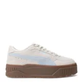Championes Puma Karmen II Idol SD, color beige arena con detalles celestes y suela marrón. Zapatillas de gamuza con plataforma y logo de Puma en el lateral.