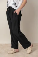 Pantalón italiano de lino azul marino, de corte amplio, con cintura elastizada y cordón ajustable.