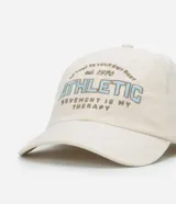 Gorra de sarga color crema con visera curva y bordado frontal con la palabra "ATHLETIC" en celeste y gris.