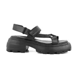 Sandalias negras de cuero sintético, con plataforma track y tiras anchas con ajuste de velcro.