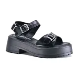 Sandalias marrones con plataforma, tiras anchas con hebillas y suela track.