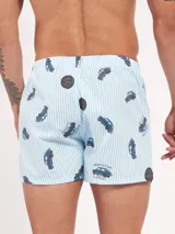 Bóxer de algodón con estampado floral en tonos azul y blanco, con cintura elástica y logo de la marca en el centro.