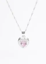 Cadena plateada con dije de corazón con piedra rosa central y borde de pequeñas circonitas.