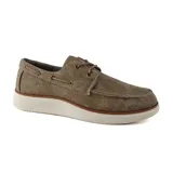 Zapato náutico azul de lona con cordones y suela blanca.