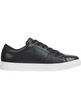 Zapatillas de cuero negras con suela blanca de goma. Logo de Tommy Hilfiger bordado en el lateral y la parte trasera.