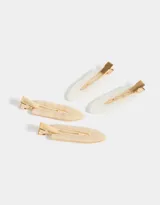 Set de cuatro hebillas para el pelo de resina con forma ovalada y broche metálico dorado.