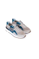 Championes urbanos color beige con detalles en azul y estampado animal print.