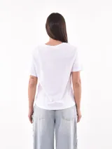 Remera color ladrillo con estampado de olas y texto "Waves of Life" en blanco.
