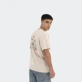 Remera color beige de corte oversize, con logo de Reef estampado en el pecho.