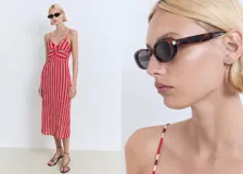 Vestido midi de tirantes finos ajustables, con escote de pico y detalle fruncido en la parte frontal del busto. Presenta un estampado de rayas verticales rojas y beige.