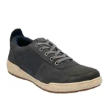 Championes Hush Puppies modelo Draper, color gris oscuro, confeccionados en cuero, con cordones grises, forro de malla mesh y plantilla Smart Foam. Suela de goma color beige.
