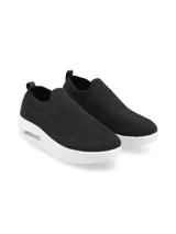 Zapatilla negra de flyknit con suela blanca y burbuja de aire.