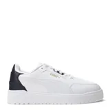 Championes urbanos Puma Shuffle Downtown, color blanco con detalles en negro y dorado, con logo Puma en el lateral y talón en contraste.