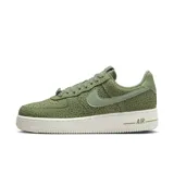 Zapatillas bajas color verde con textura de serpiente, diseño clásico de Nike.