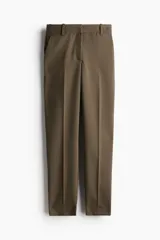 Pantalón tobillero color marrón, de corte ajustado y tiro medio.