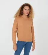 Buzo de punto negro de algodón, con cuello redondo y mangas largas.