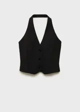 Chaleco negro con cuello halter, espalda descubierta y cierre frontal con botones.