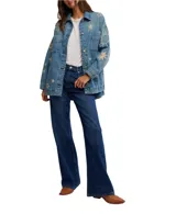 Chaqueta de algodón con bordados de sol, estrella y luna. Tiene cuello monocolor, bolsillos en el pecho y en el bajo, cierre de botones completo y hombros caídos.