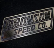 Gorro negro de cinco paneles con logo de Bronson Speed Co. bordado en el frente.