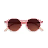 Lentes de sol Izipizi modelo D Sun, con montura redonda color rosado y cristales marrones degradados.
