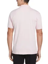 Polo rosa de tejido interlock, diseño liso con el clásico logo Sticker Pete bordado al pecho. Un básico de la línea Daddy.