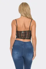 Corset importado de tul elástico armado, color negro, con copas recubiertas de strass en diferentes tonos. Tiene cierre lateral invisible y tiras ajustables.