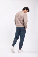 Pantalón deportivo jogger color verde petróleo, con cintura elástica ajustable con cordón.