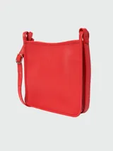Bandolera Longchamp modelo Le Foulonné, color crudo, con correa fina regulable, cierre superior y logo grabado en el frente.