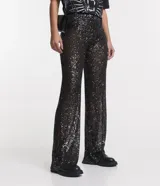 Pantalón largo de lentejuelas negras metalizadas con forro y cintura elástica.
