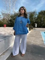 Pantalón palazzo blanco de lino, con cintura elástica.