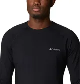 Camiseta térmica de manga larga Columbia, color negro, con cuello redondo y logo de la marca en el pecho. Diseñada con tecnología Omni-Heat Infinity para retener el calor corporal y Omni-Wick para absorber la humedad.