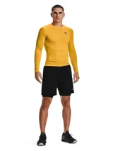 Short deportivo Under Armour HeatGear Armour para hombre, color negro con logo de la marca en la pierna izquierda y cintura elástica con la inscripción "UNDER ARMOUR".