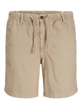 Short chino color beige de fit relajado con tiro semi caído. Cintura con cierre de cremallera y cordón ajustable. Bolsillos delanteros y traseros. Confeccionado en tejido canvas de algodón y lino.