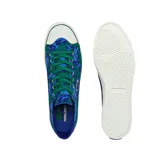 Zapatillas Lacoste modelo Gripshot, edición limitada Minecraft, con estampado pixelado en tonos azules y verdes, logo de Lacoste bordado en el lateral y suela blanca.