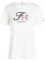Remera blanca de algodón con logo gráfico de Tommy Hilfiger en azul y rojo.