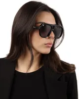Lentes de sol negros estilo aviador con protección UV400 y polarizados.