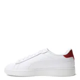 Championes Puma Smash 3.0 L de cuero sintético negro con detalles en blanco, suela blanca y logo de Puma en el lateral.