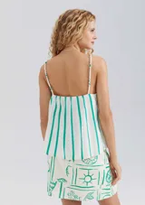 Blusa sin mangas a rayas verticales blancas y verdes, con tirantes finos.