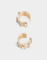 Set de dos earcuffs dorados de metal con strass.