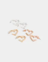 Set de tres pares de aros tipo argolla con forma de corazón, bañados en oro rosa, oro y plata.