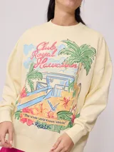 Sweater color crema con estampado frontal de motivos playeros y bordado. Confeccionado en 60% algodón y 40% poliéster.